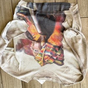 Off white shiny picture of ethnic lady on shirt